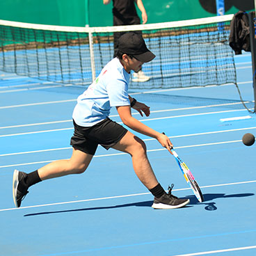 Physical Education - boy playing tennis