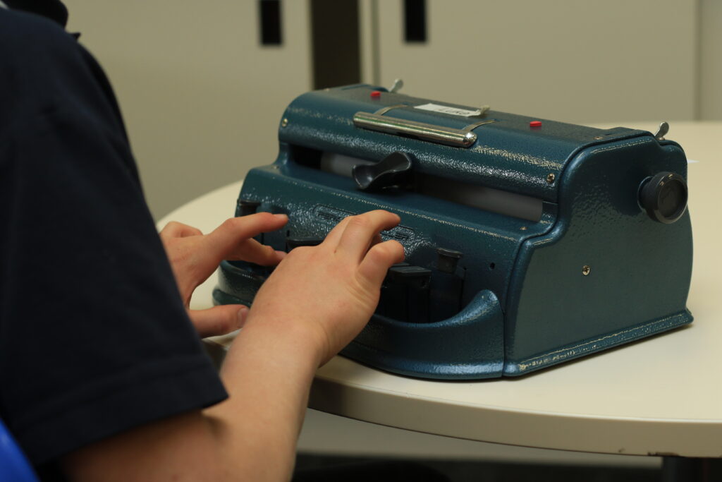 a Braille typewriter designed for individuals with vision impairments